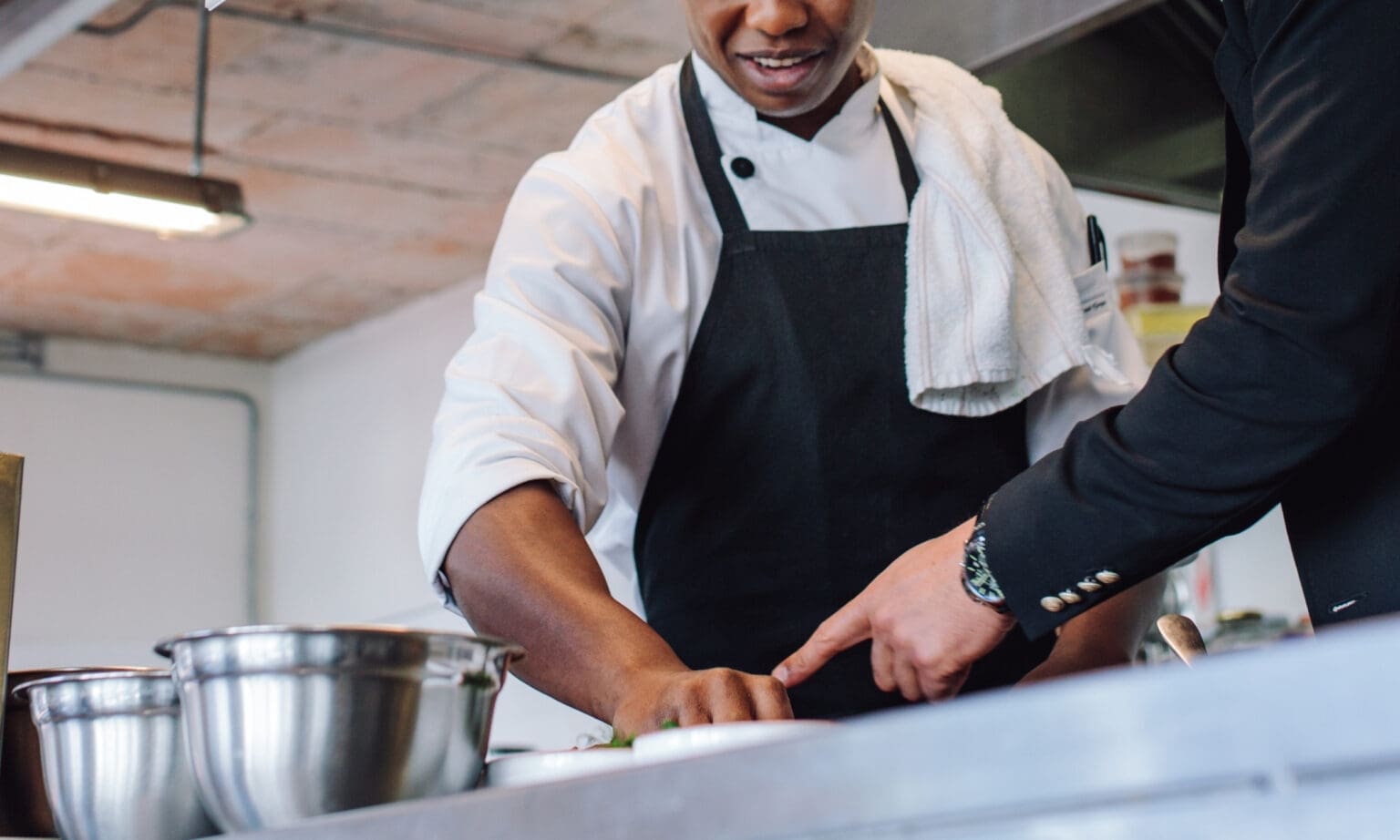 Restaurant chef in a kitchen consulting